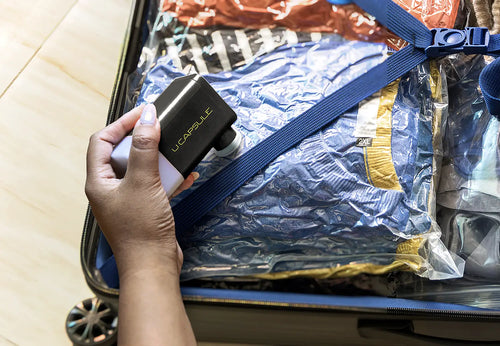 U Capsule being packed in a suitcase