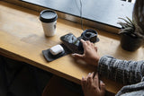 Powerpad Pro at coffee shop charging Apple devices